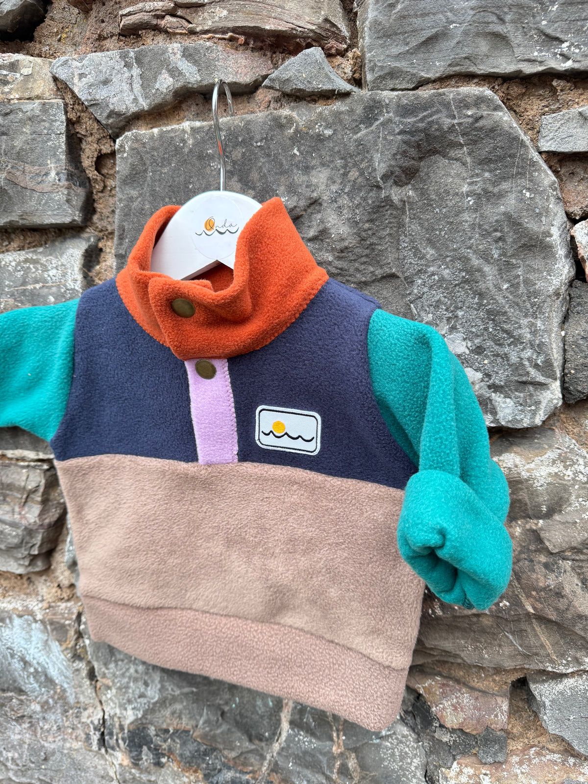 New born with buttons