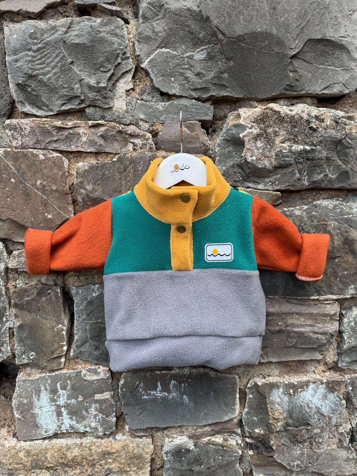 New born with buttons