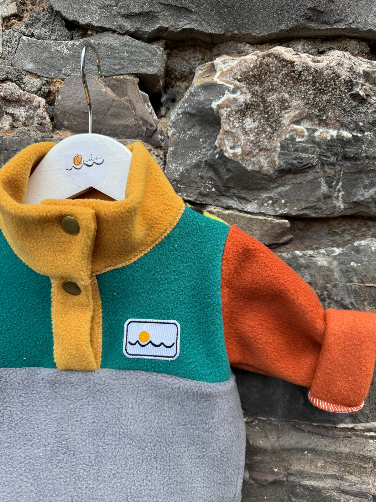 New born with buttons